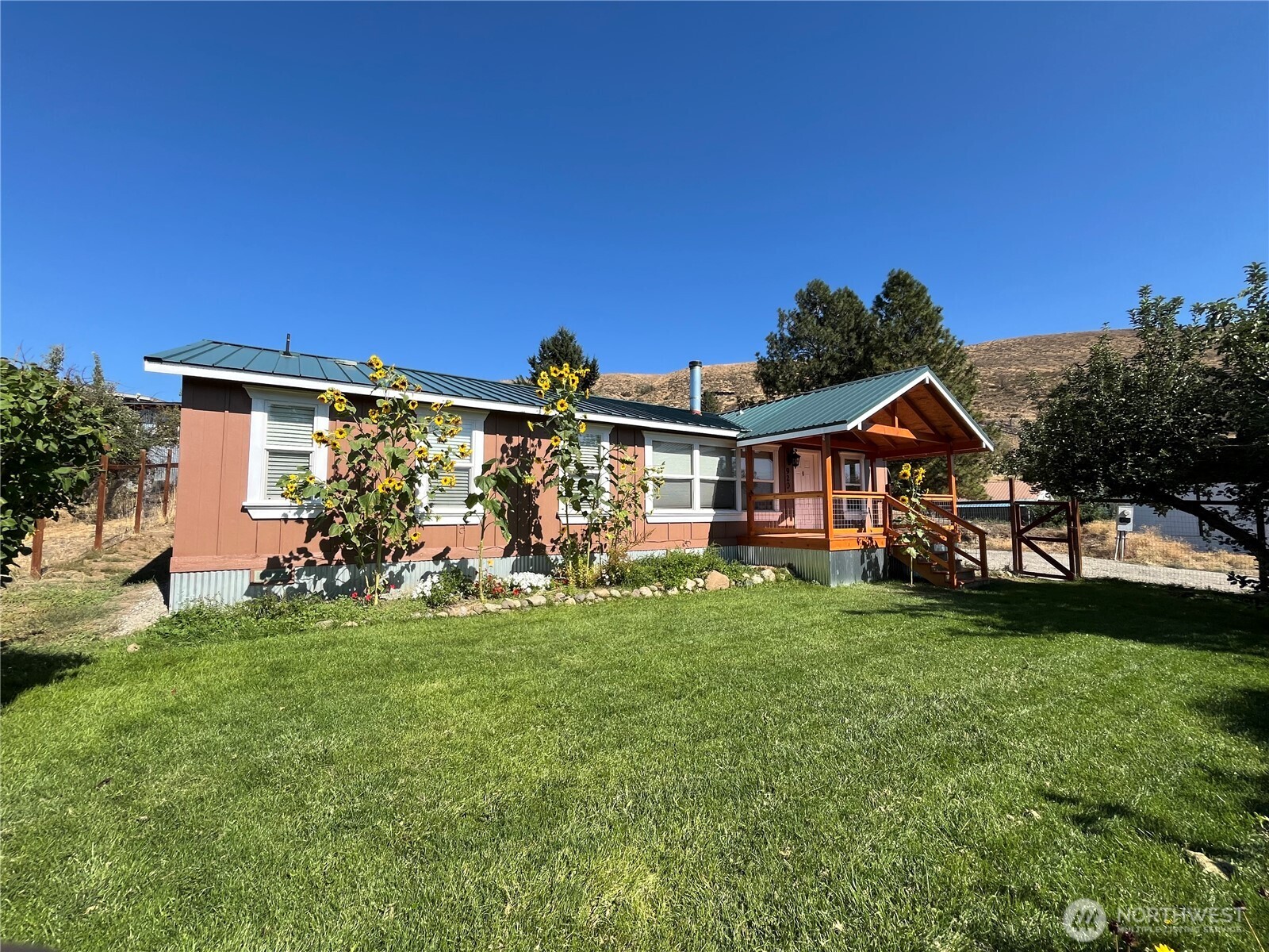 920 Castle Avenue Winthrop, WA 98862 - Photo 2 of 40 a view of front of house with a yard