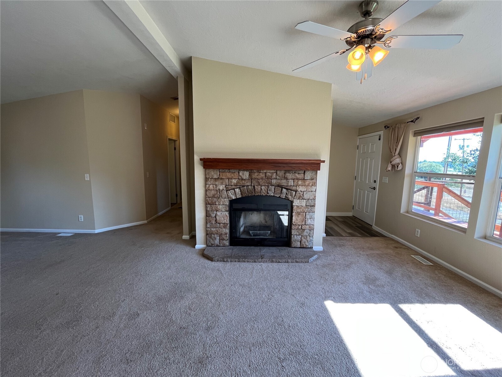 920 Castle Avenue Winthrop, WA 98862 - Photo 22 of 40 a view of a livingroom with a fireplace and window