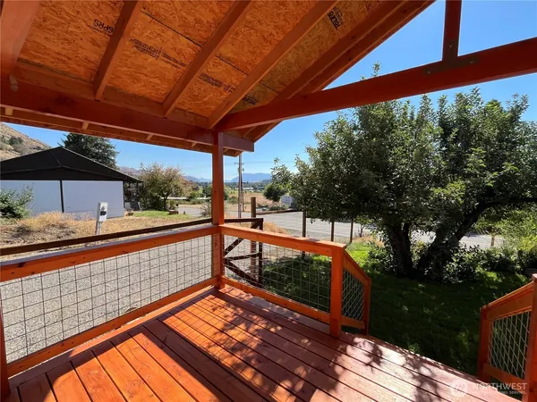 a view of balcony with wooden floor