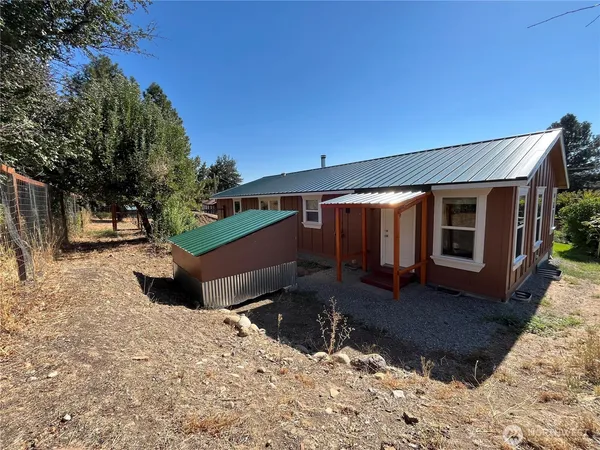 a backyard of a house with lots of green space