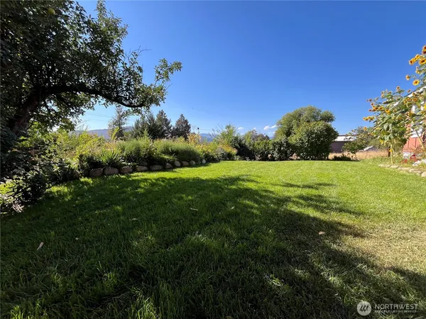 a backyard of a house with lots of green space