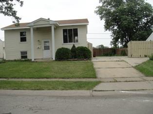 306 McKool Avenue Romeoville, IL 60446 - Photo 1 of 1 a front view of a house with a yard