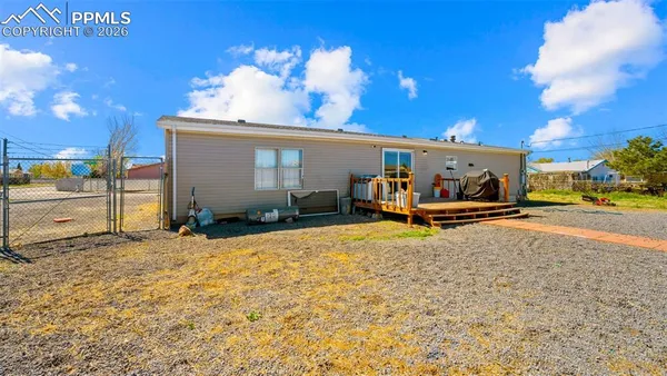 a view of a house with outdoor space and sitting area