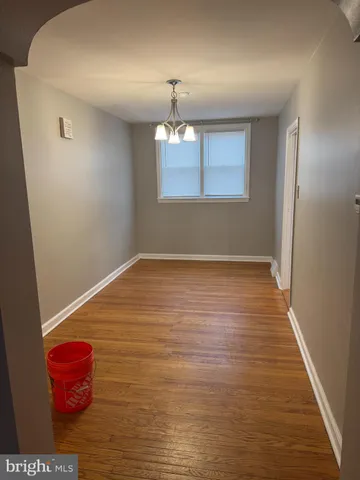 a view of room with wooden floor