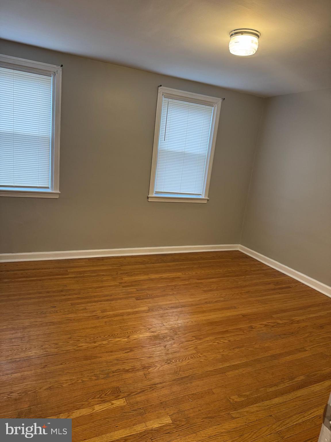 5149 Arbor Street Philadelphia, PA 19120 - Photo 9 of 23 a view of an empty room with wooden floor and a window