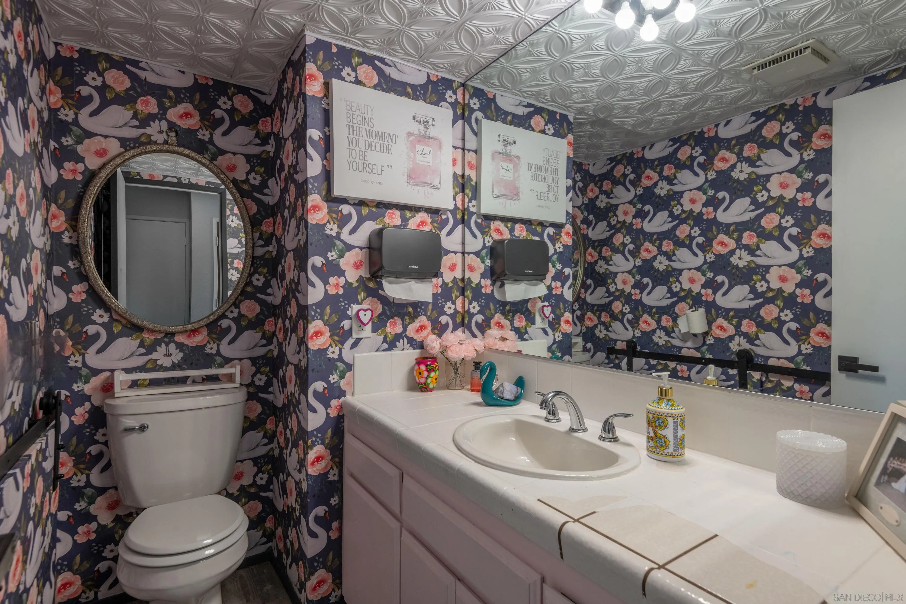 7585 Eads Avenue, Unit A La Jolla, CA 92037 - Photo 12 of 33 a bathroom with a toilet sink and mirror