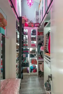 a vase of flowers sitting on a floor