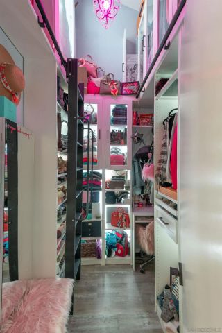 a vase of flowers sitting on a floor