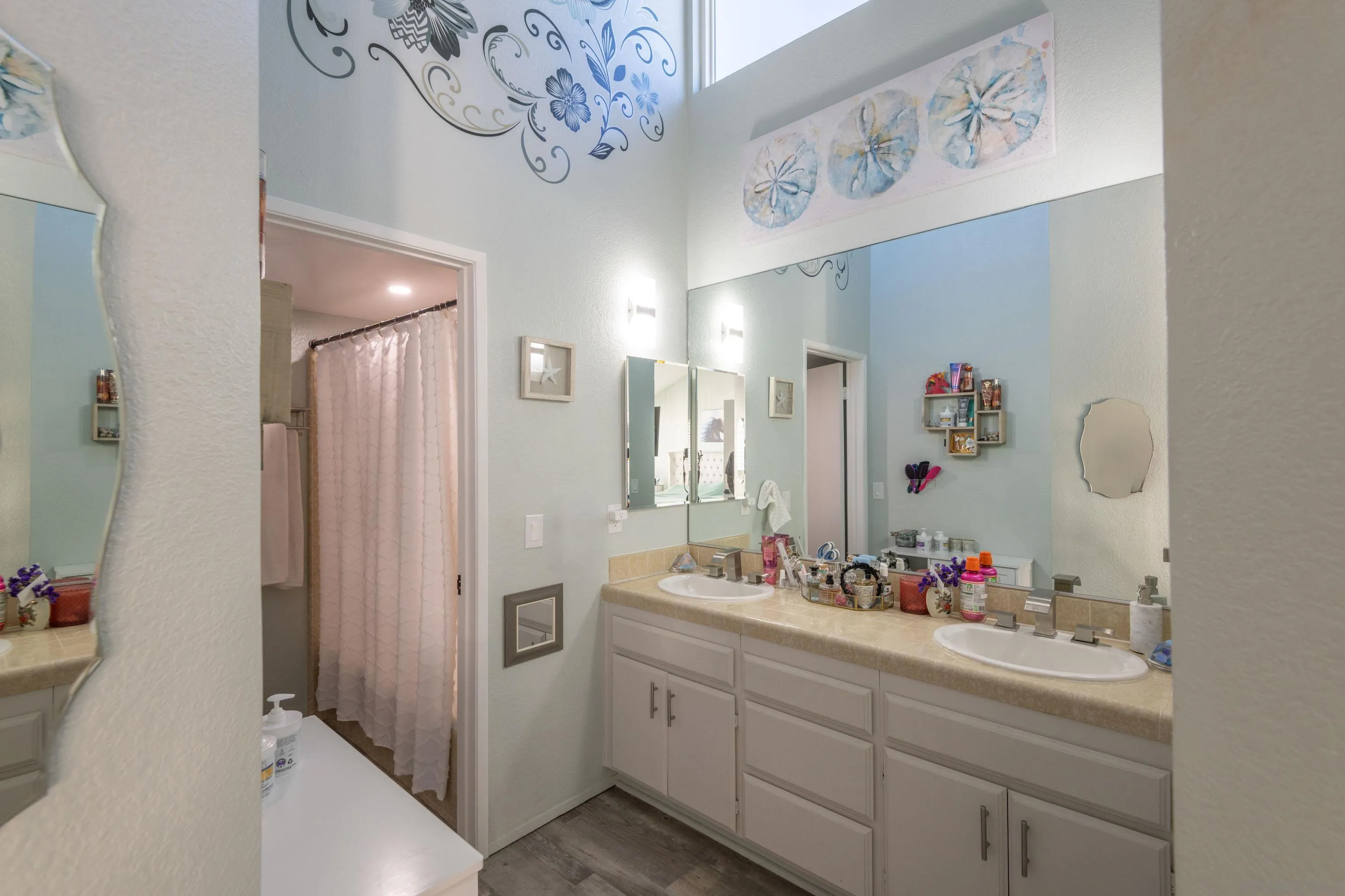 7585 Eads Avenue, Unit A La Jolla, CA 92037 - Photo 16 of 33 a bathroom with a mirror sink and shower