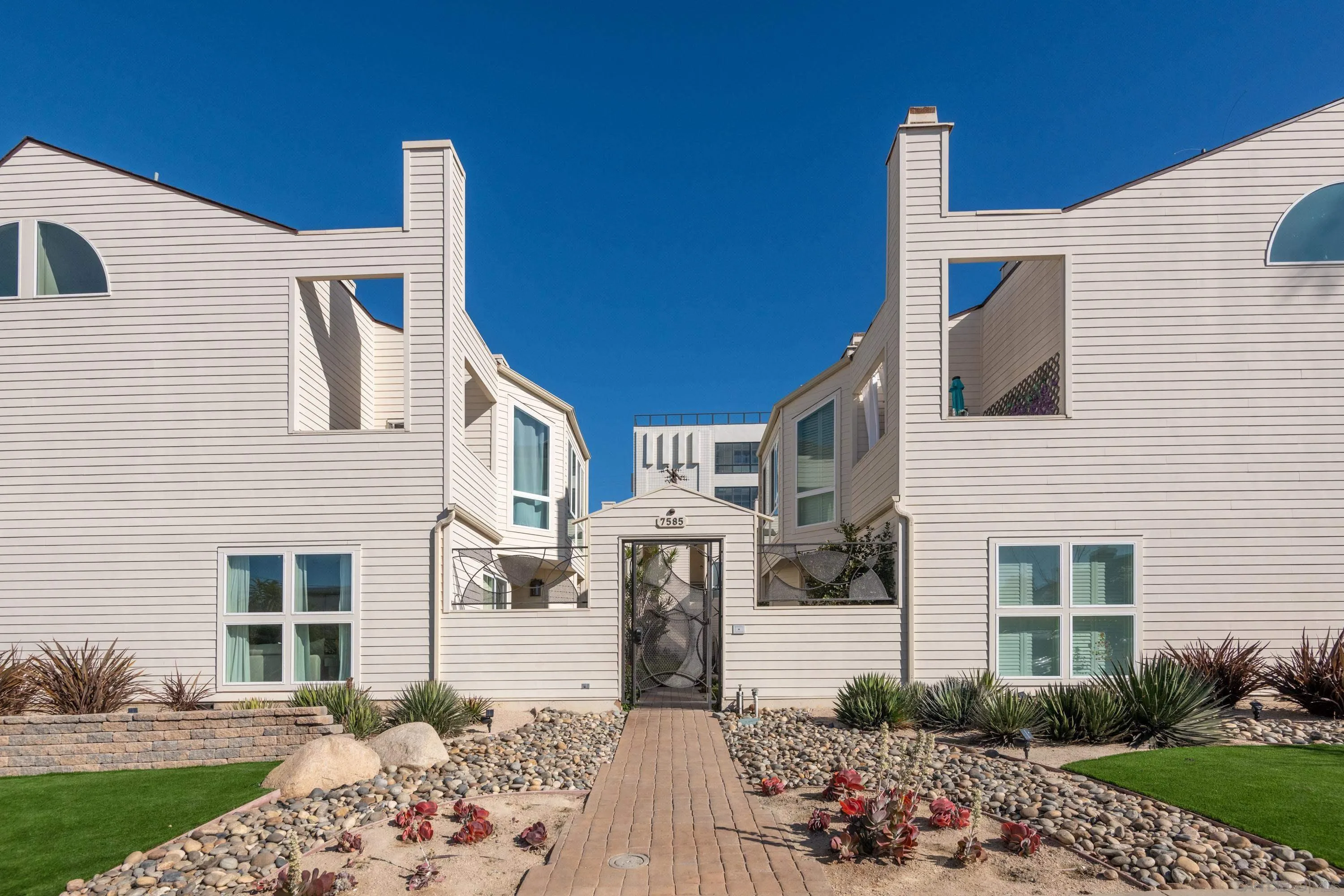 7585 Eads Avenue, Unit A La Jolla, CA 92037 - Photo 2 of 33 a front view of a house with a yard