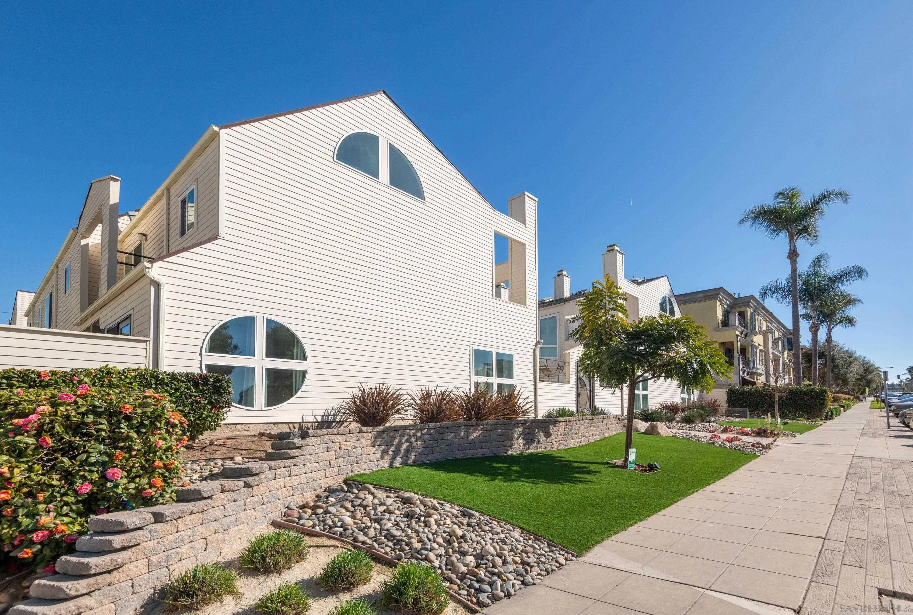 7585 Eads Avenue, Unit A La Jolla, CA 92037 - Photo 33 of 33 a front view of a house with a yard