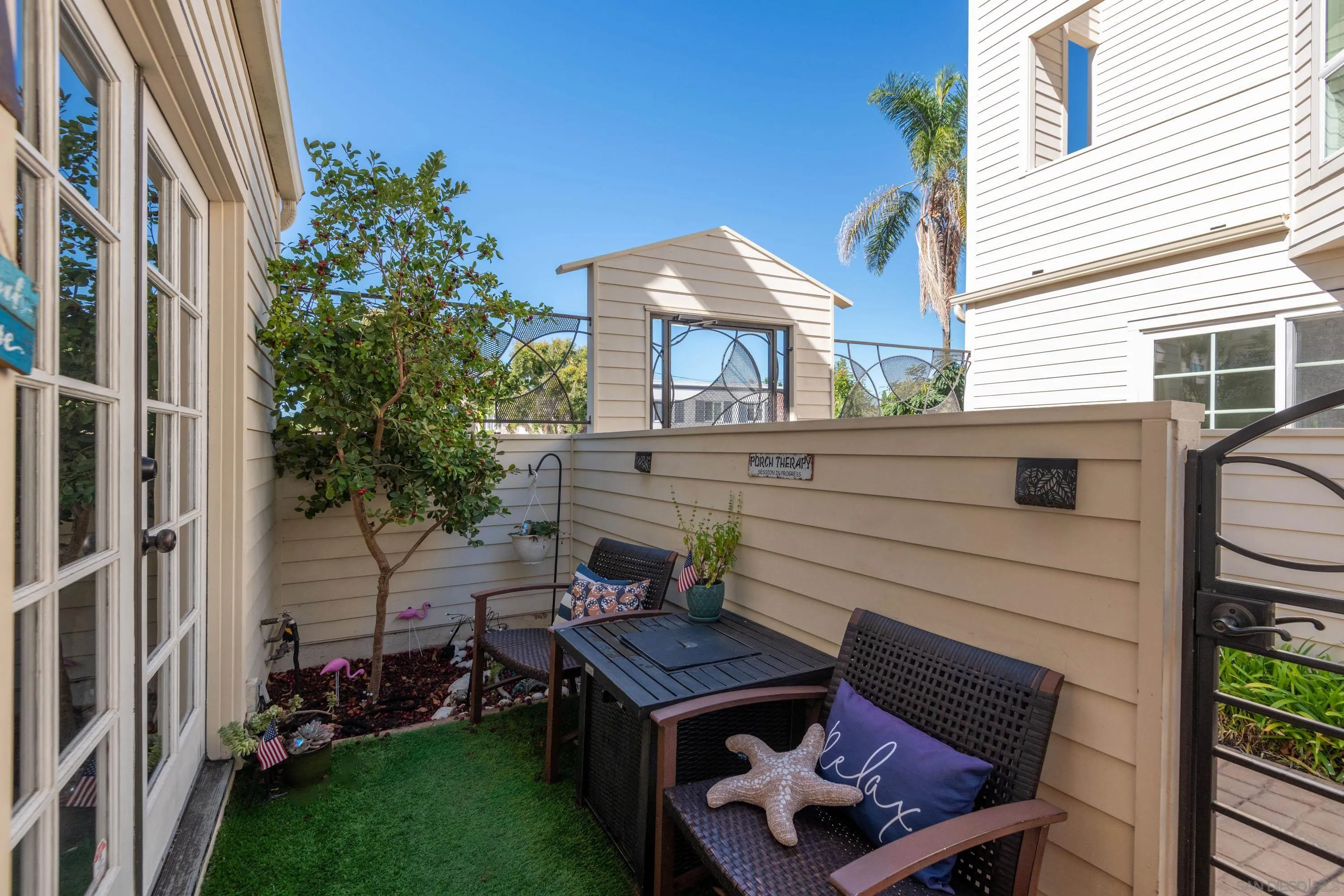 7585 Eads Avenue, Unit A La Jolla, CA 92037 - Photo 5 of 33 a backyard of a house with outdoor seating