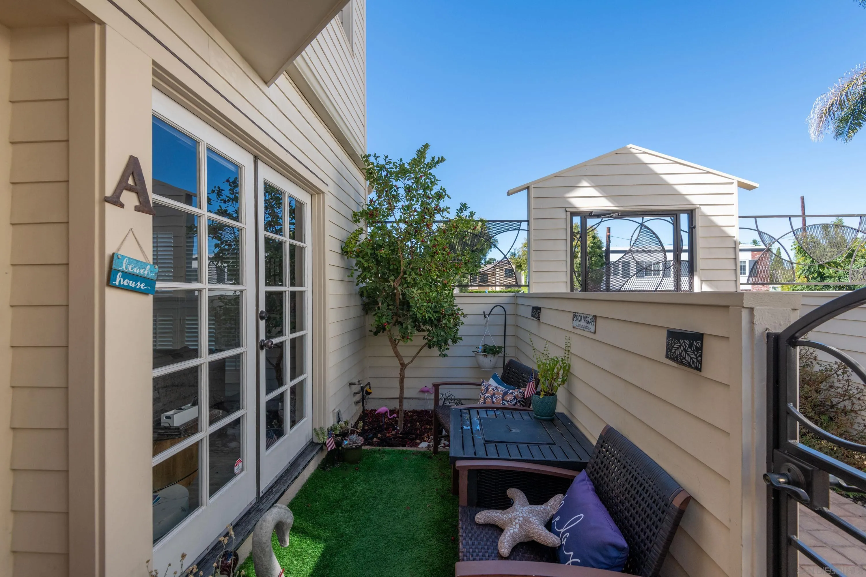 7585 Eads Avenue, Unit A La Jolla, CA 92037 - Photo 6 of 33 a view of a house with a yard and furniture