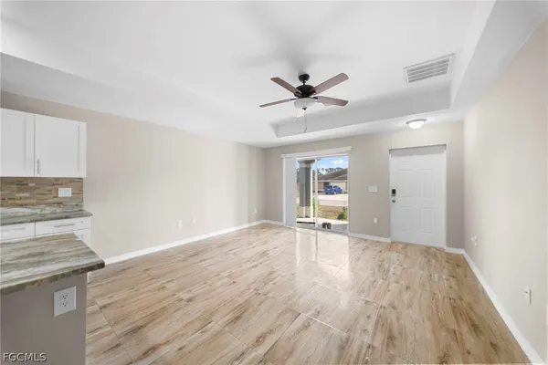 a view of an empty room and window