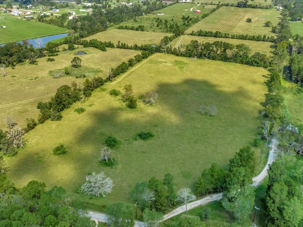 655 Sam Baird Road Lufkin, TX 75901 - Photo 8 of 15 a view of a lake with a yard