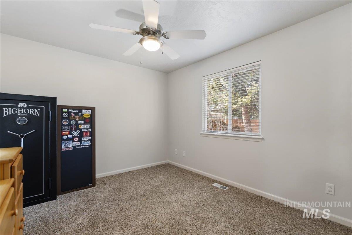 4167 North Arches Way Meridian, ID 83646 - Photo 21 of 36 Carpeted empty room with baseboards and ceiling fan