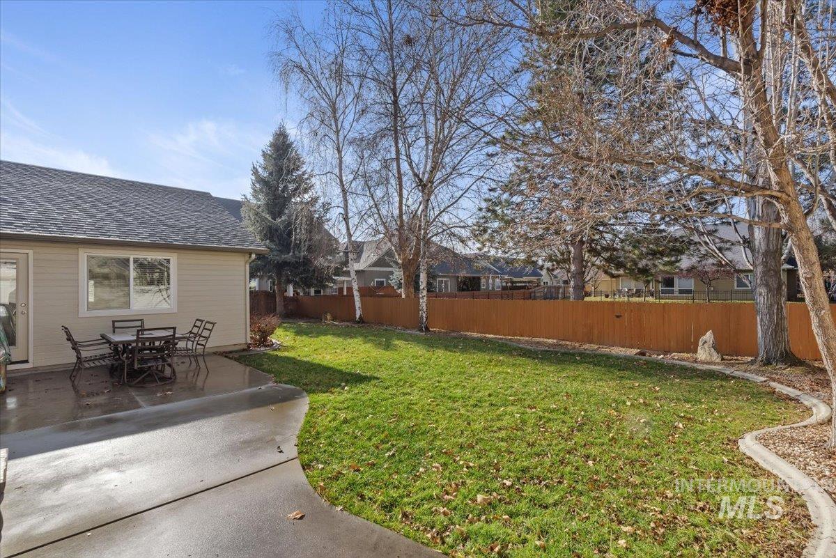 4167 North Arches Way Meridian, ID 83646 - Photo 29 of 36 Fenced backyard featuring outdoor dining area and a patio