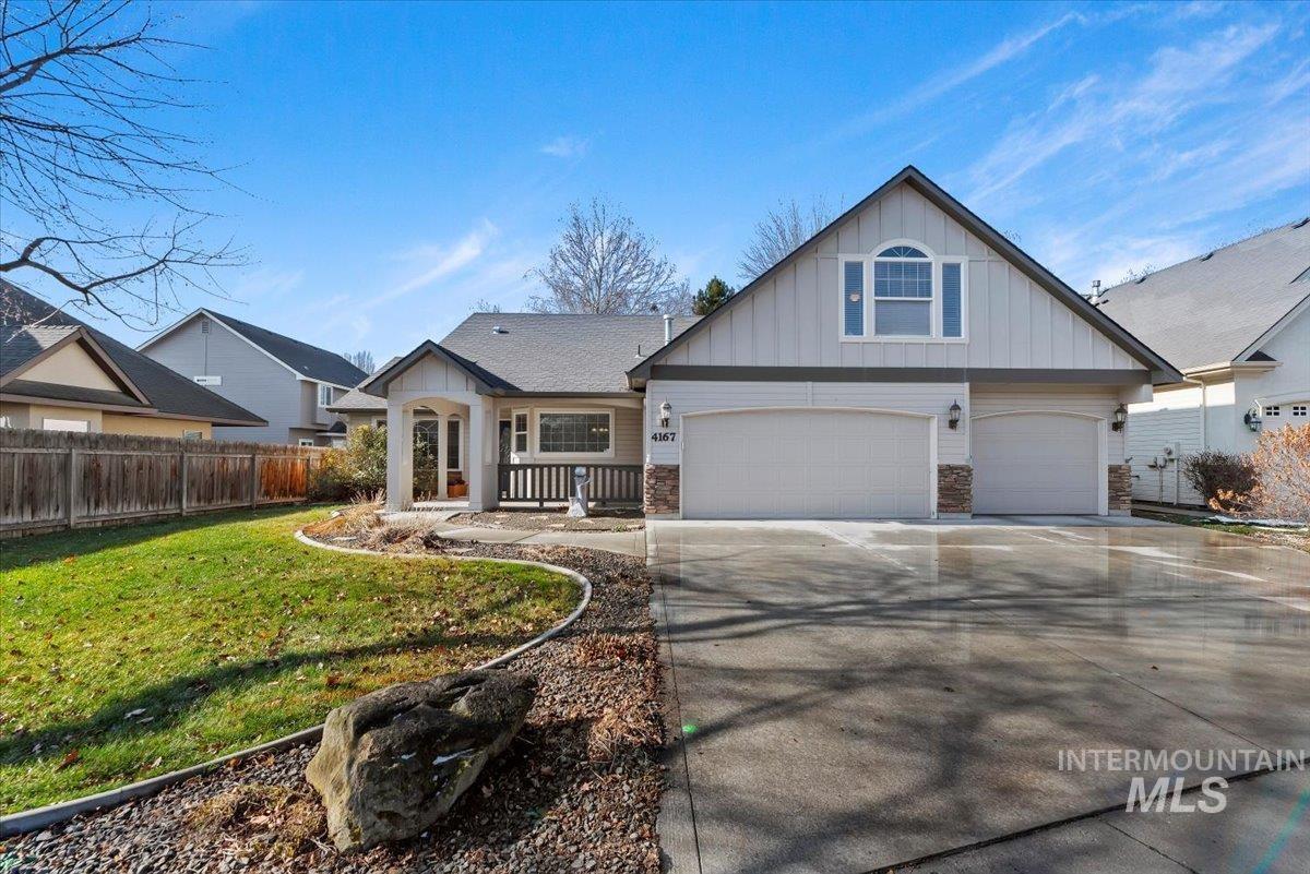 4167 North Arches Way Meridian, ID 83646 - Photo 3 of 36 View of front of property with board and batten siding, concrete driveway, and a garage