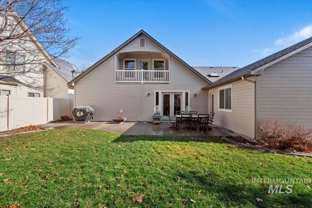 4167 North Arches Way Meridian, ID 83646 - Photo 32 of 36 Rear view of house featuring a patio area, french doors, and a balcony