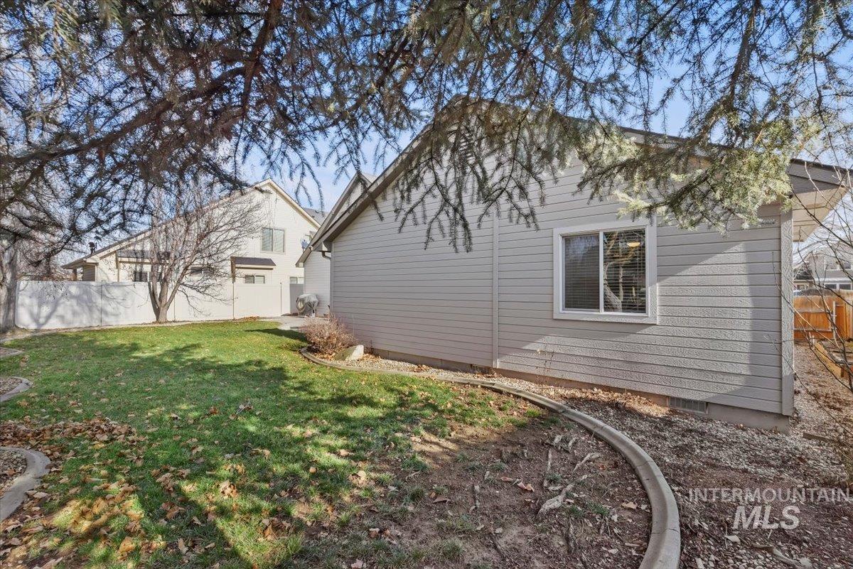 4167 North Arches Way Meridian, ID 83646 - Photo 33 of 36 View of side of property featuring a fenced backyard