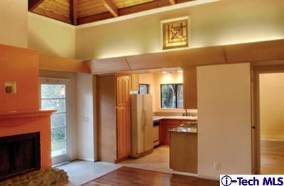 Undisclosed Address Pasadena, CA 91105 - Photo 14 of 16 a view of a hallway with wooden floor and a fireplace