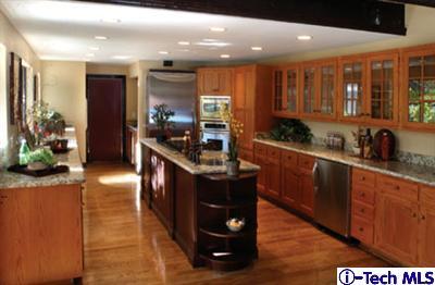 Undisclosed Address Pasadena, CA 91105 - Photo 3 of 16 a kitchen with stainless steel appliances granite countertop a sink a stove and a wooden floors