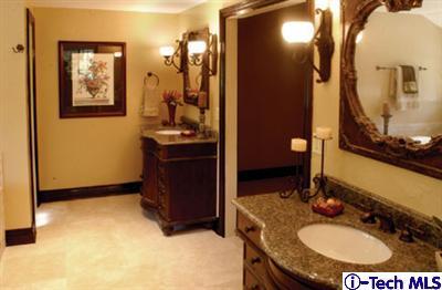 Undisclosed Address Pasadena, CA 91105 - Photo 6 of 16 a bathroom with a granite countertop sink a mirror and a toilet