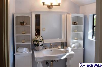 Undisclosed Address Pasadena, CA 91105 - Photo 9 of 16 a bathroom with a sink and a mirror