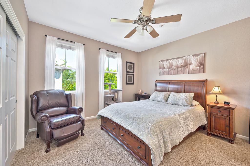 2603 Las Palomas Loop Lincoln, CA 95648 - Photo 18 of 28 a bedroom with a large bed and a couch