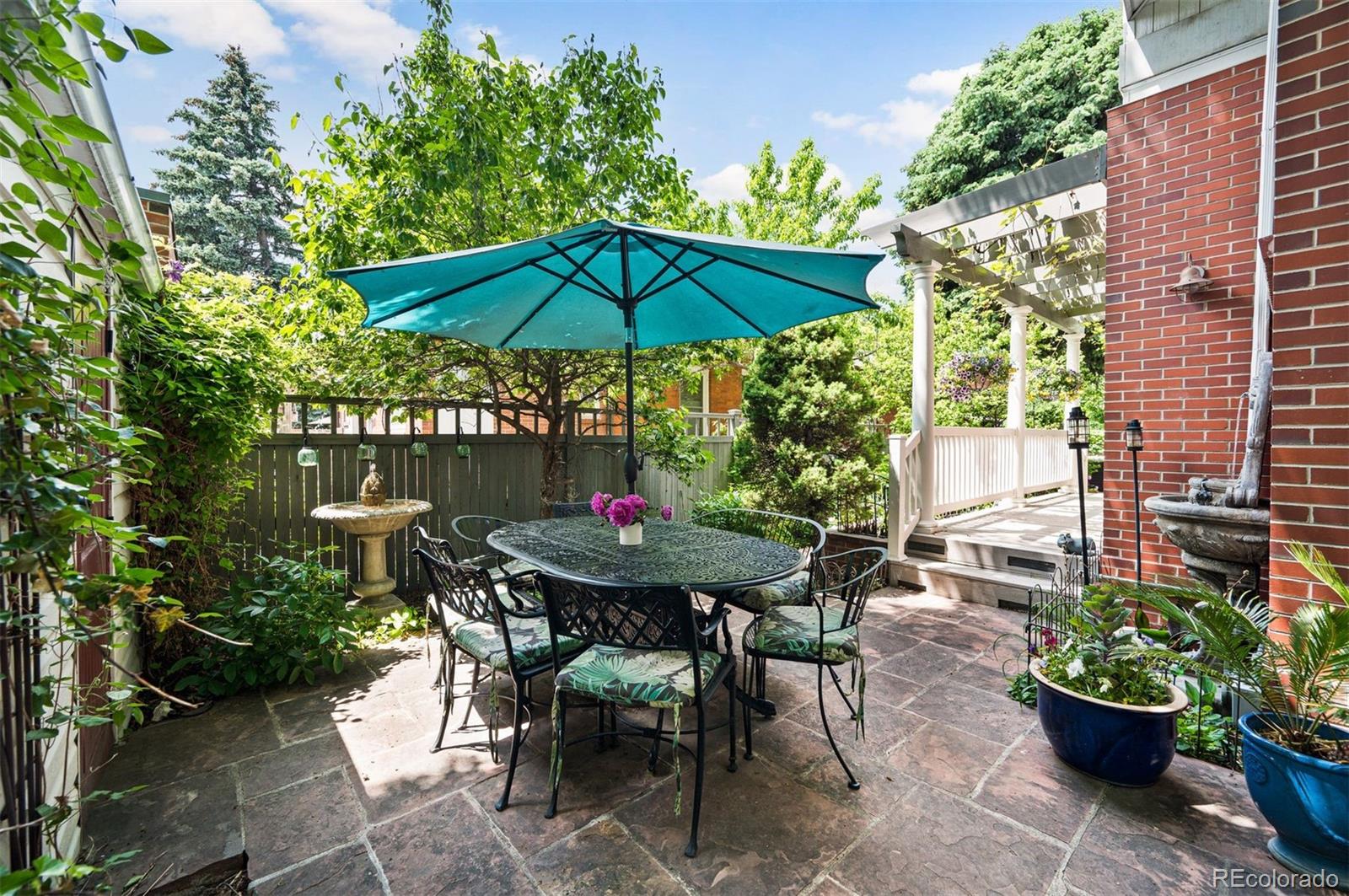 1324 South University Boulevard Denver, CO 80210 - Photo 13 of 47 a view of a backyard with sitting area and furniture