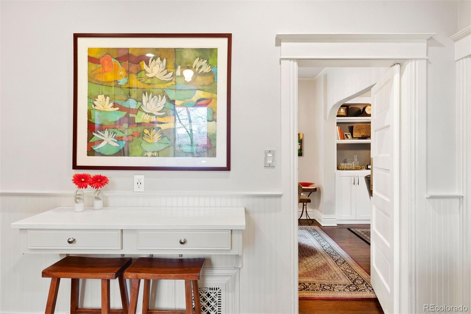 1324 South University Boulevard Denver, CO 80210 - Photo 23 of 47 a hallway with a large window and mirror