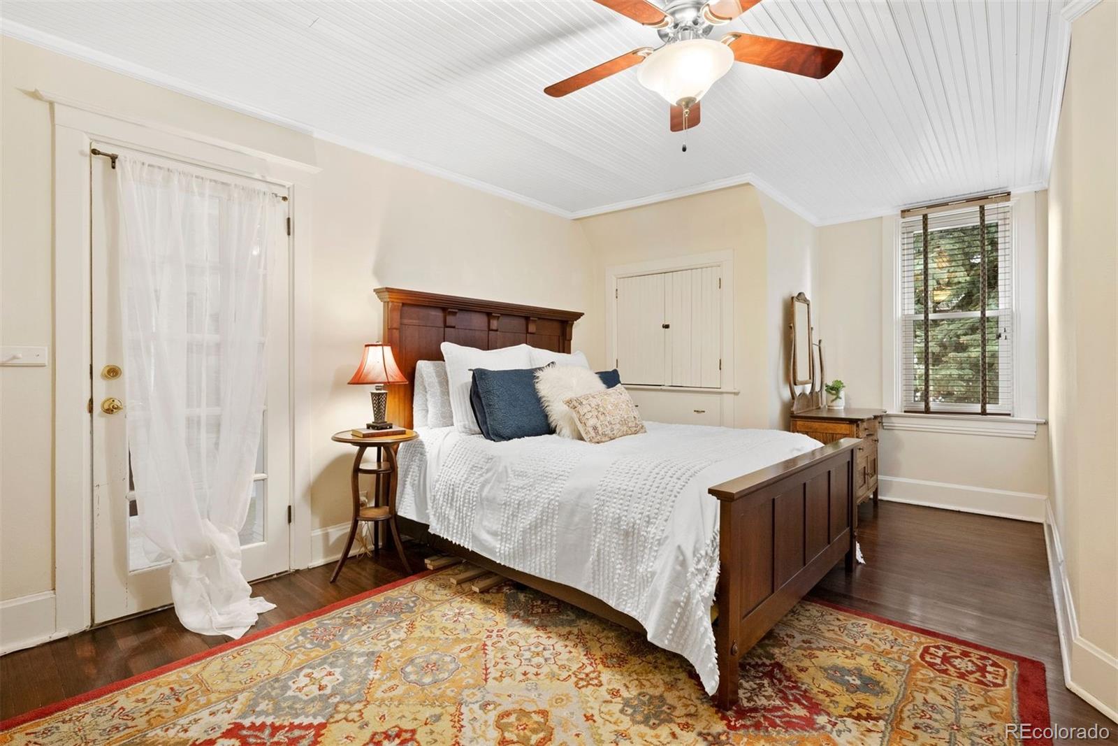 1324 South University Boulevard Denver, CO 80210 - Photo 34 of 47 a bedroom with a bed and a window