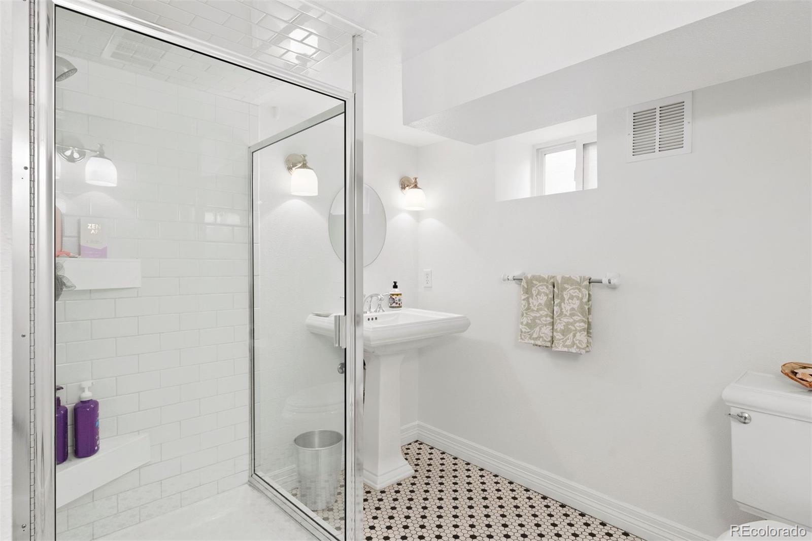 1324 South University Boulevard Denver, CO 80210 - Photo 41 of 47 a bathroom with a shower and a toilet