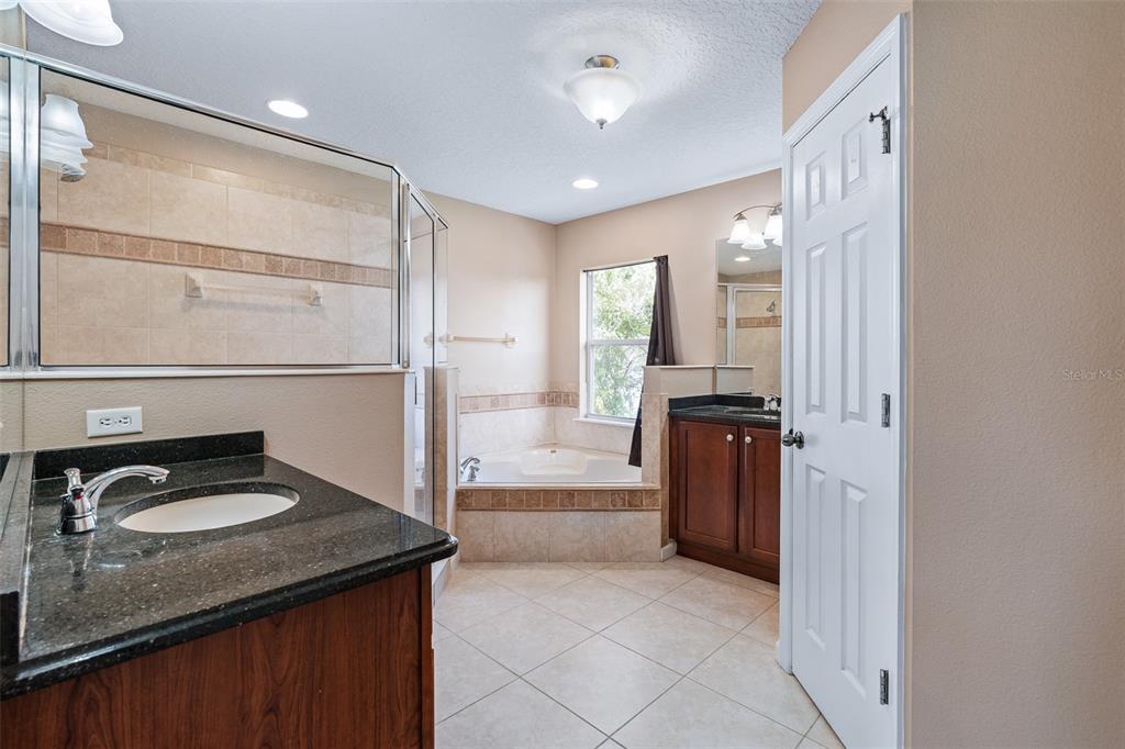 1929 Cove Point Road Port Orange, FL 32128 - Photo 22 of 45 a kitchen with granite countertop a refrigerator and a sink