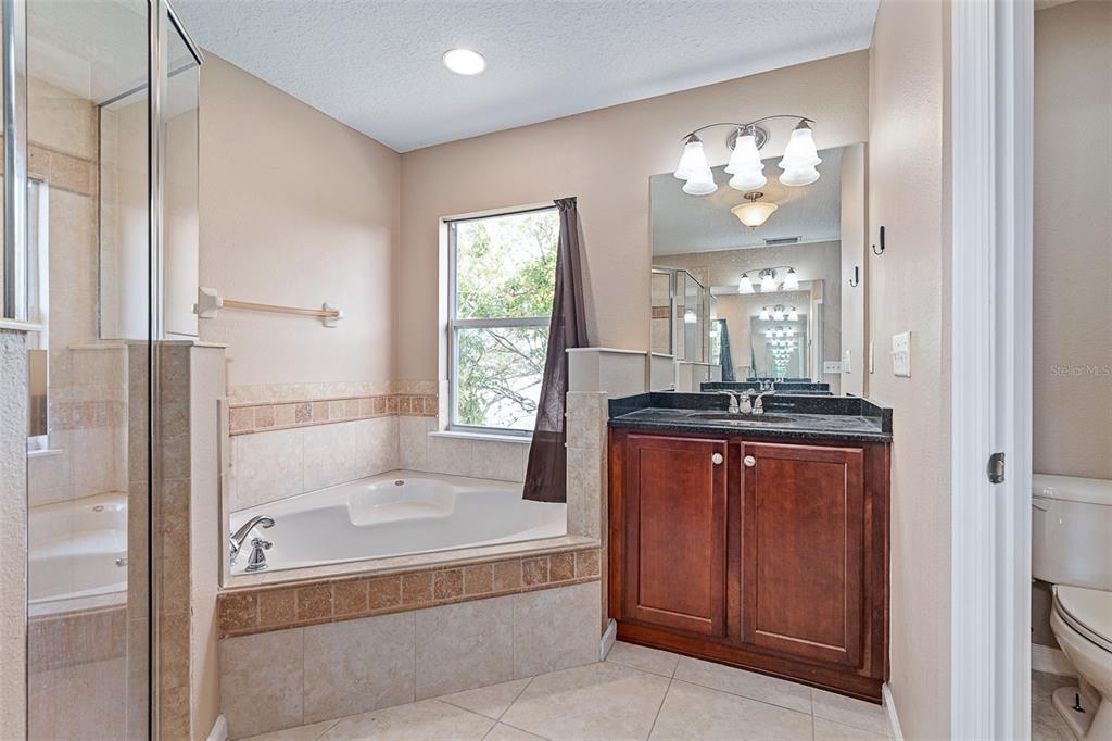 1929 Cove Point Road Port Orange, FL 32128 - Photo 23 of 45 a bathroom with a bathtub and a shower