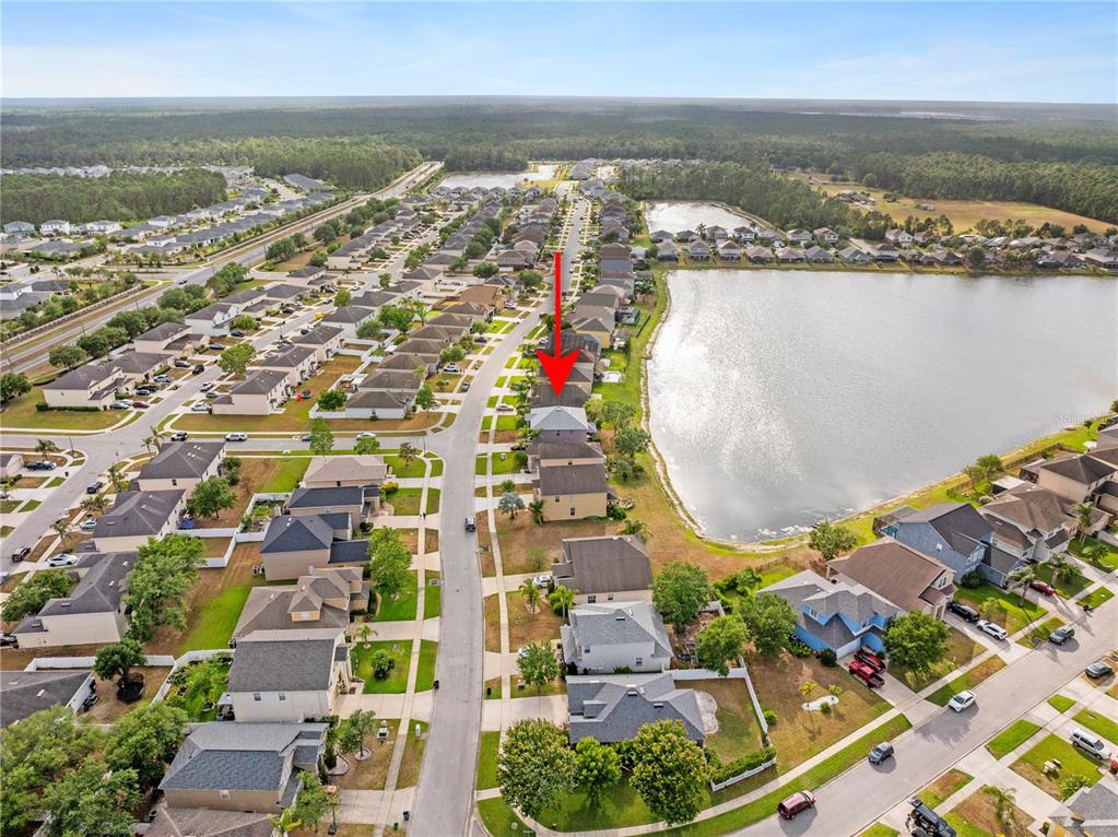 1929 Cove Point Road Port Orange, FL 32128 - Photo 43 of 45 an aerial view of residential building and lake