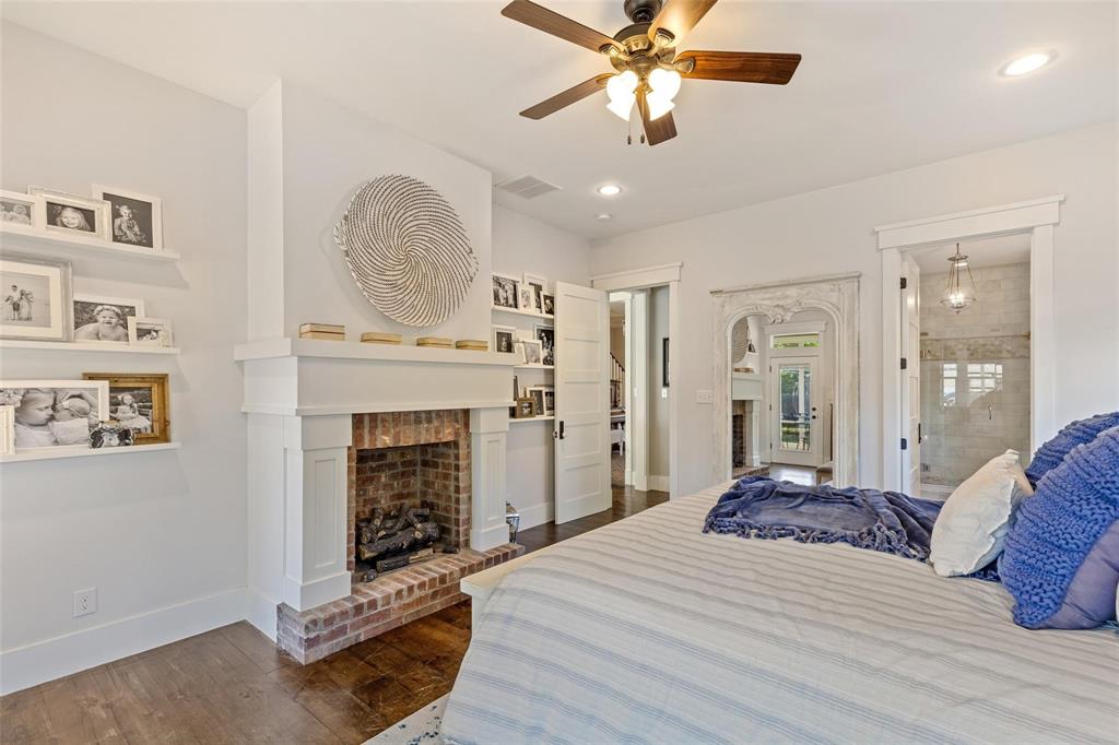 1109 East Oakdale Road Irving, TX 75060 - Photo 7 of 33 a bedroom with a bed and a fireplace