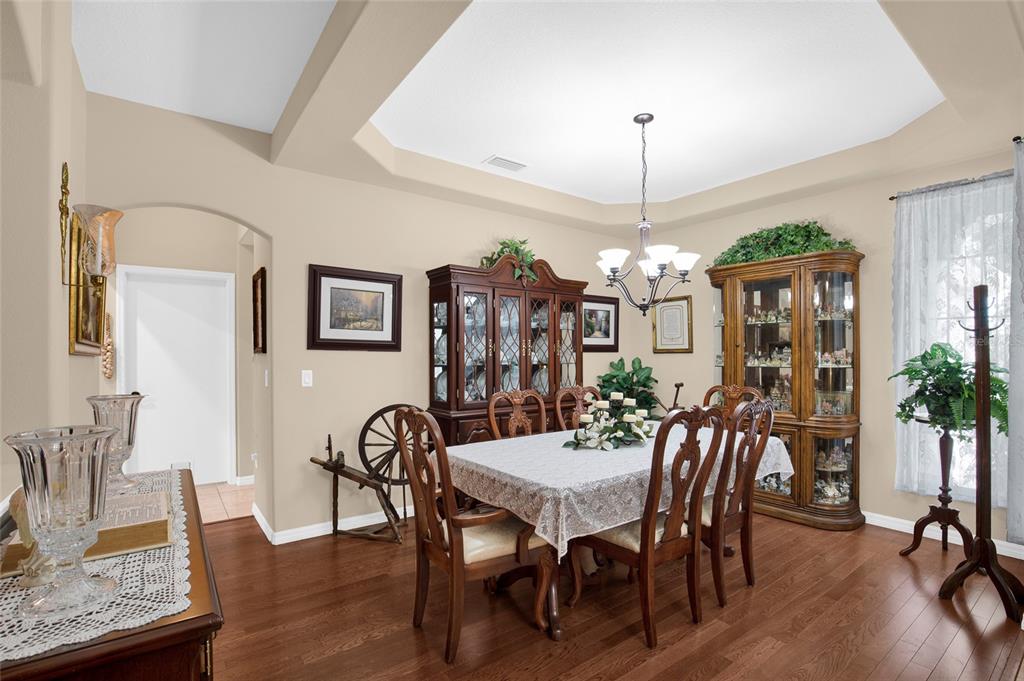 16411 Southwest 14th Avenue Road Ocala, FL 34473 - Photo 4 of 59 a view of a dining room with furniture window and wooden floor