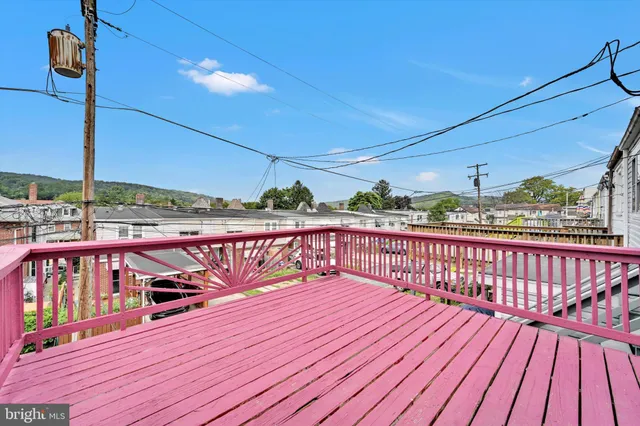 a balcony with wooden floor