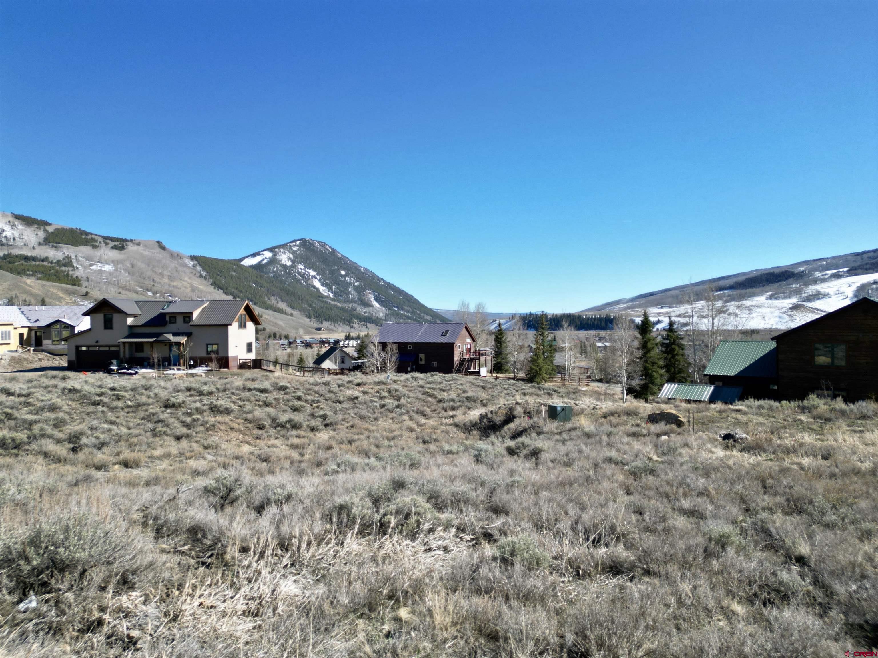 162 Bryant Avenue Crested Butte, CO 81224 - Photo 15 of 19 a view of a house with a yard