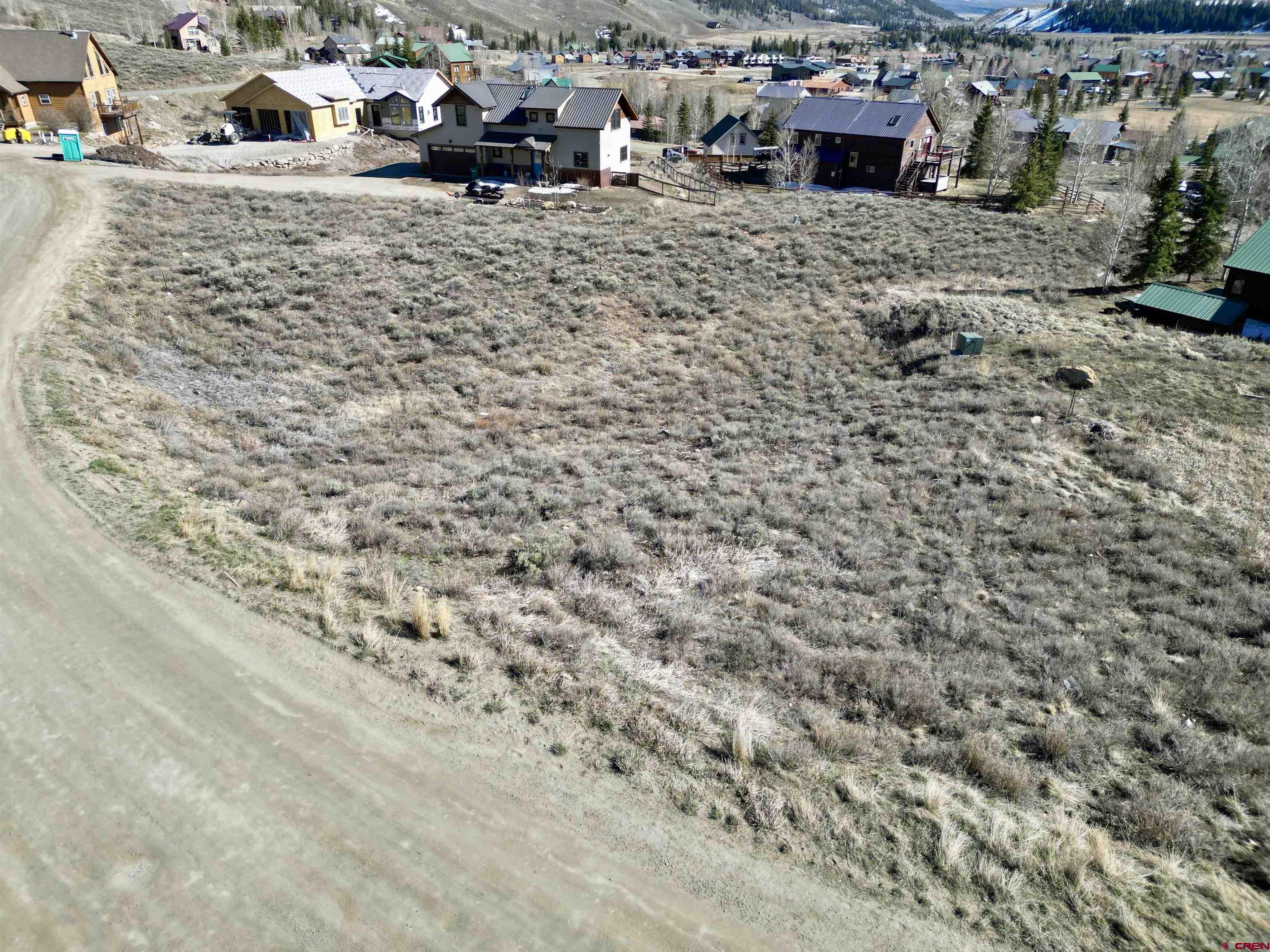 162 Bryant Avenue Crested Butte, CO 81224 - Photo 9 of 19 a view of a dry yard with wooden fence