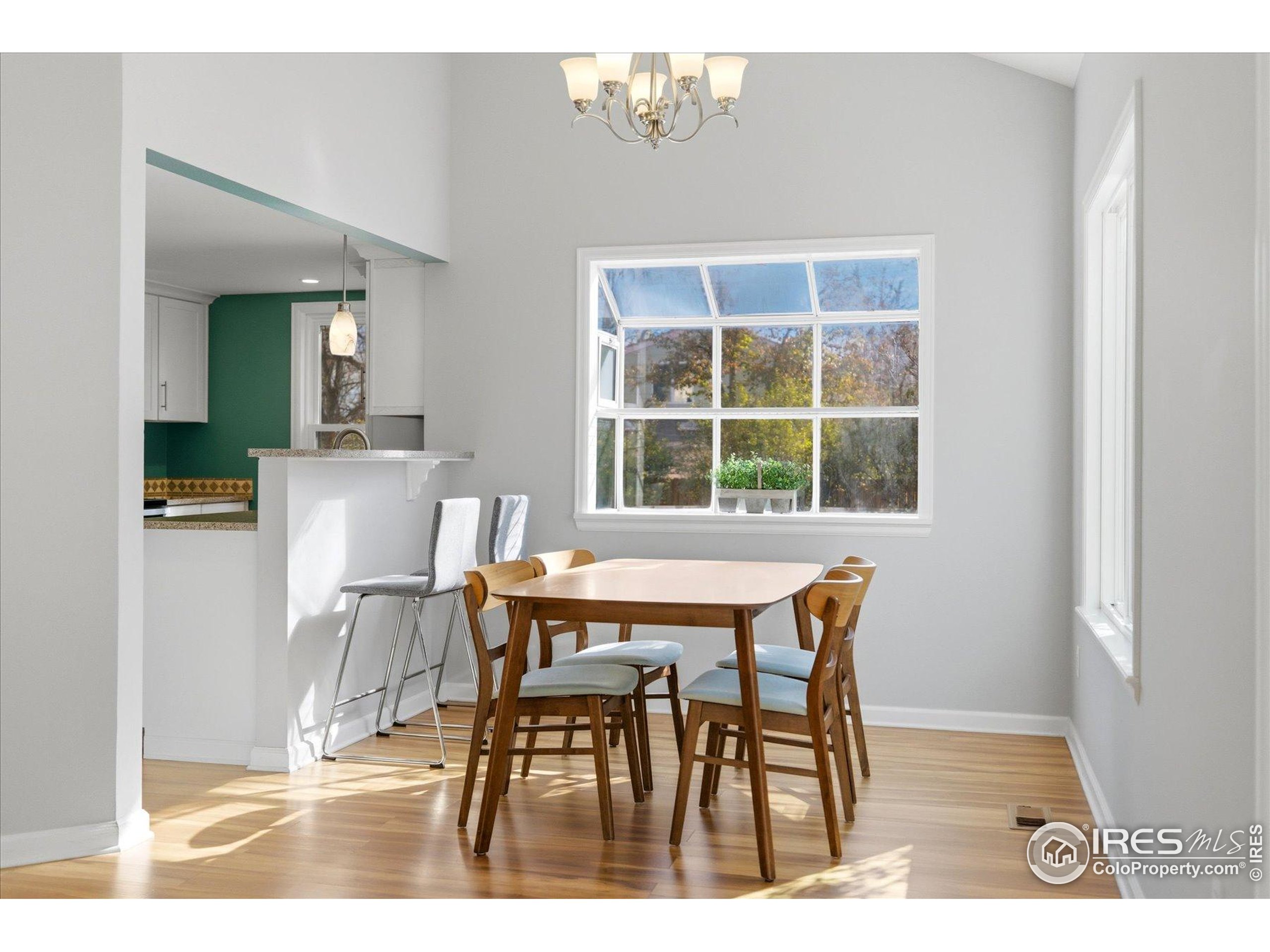 1812 Rice Street Longmont, CO 80501 - Photo 11 of 44 a dining room with furniture and window