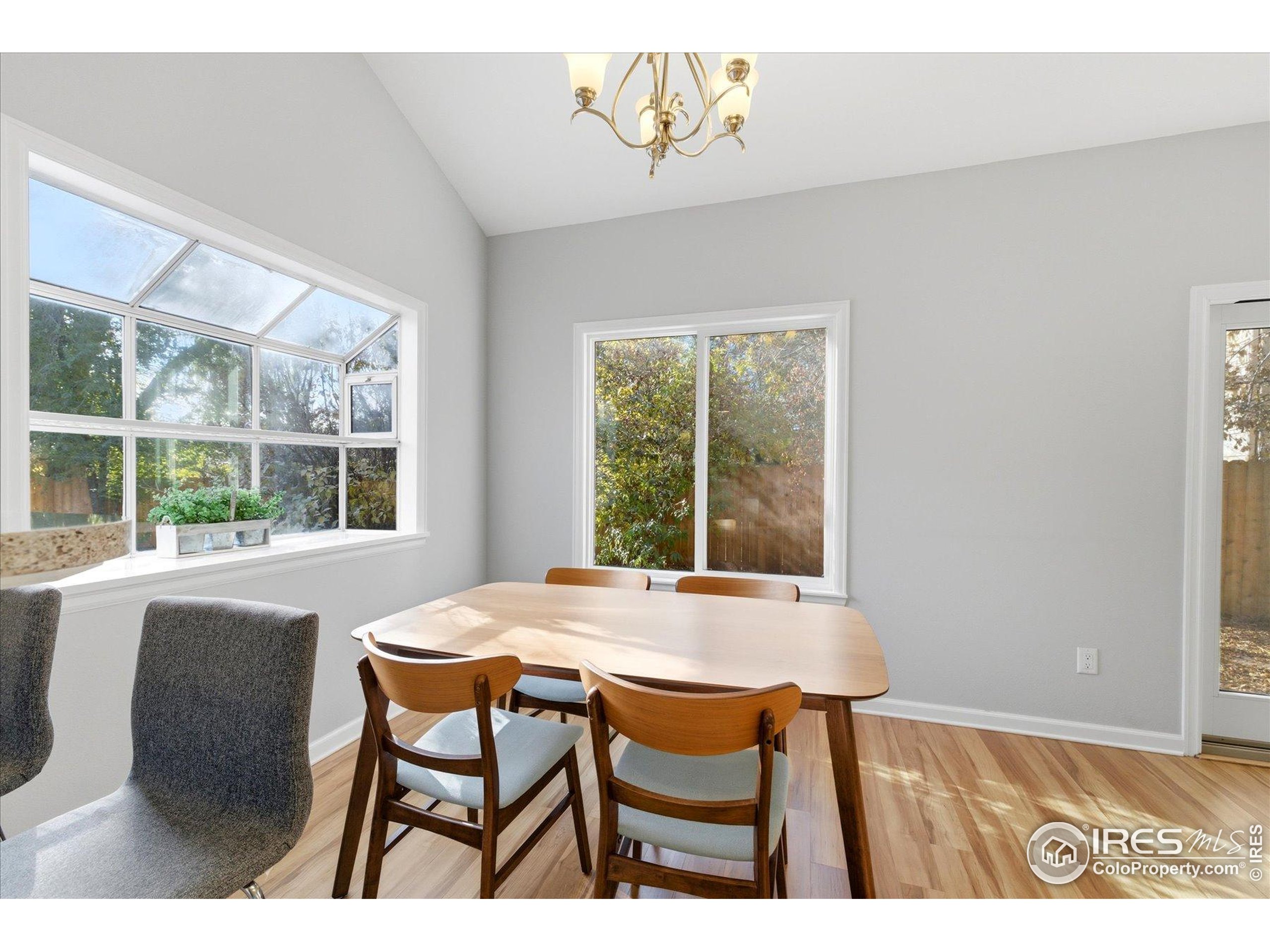 1812 Rice Street Longmont, CO 80501 - Photo 12 of 44 a view of a dining room with furniture and window
