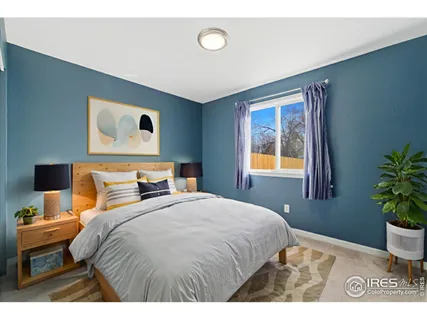 a bedroom with a bed and a potted plant
