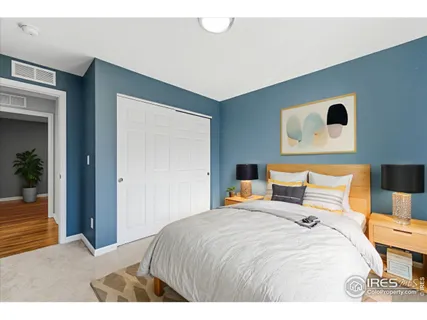 a bedroom with a bed and lamp