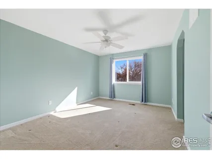 a view of an empty room with a window