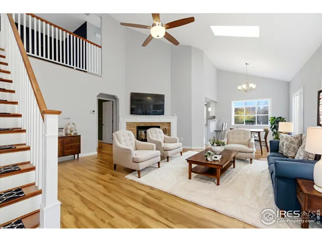 a living room with furniture or couch and a wooden floor