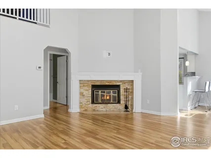 a view of an empty room and wooden floor