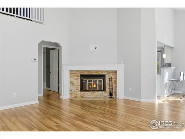 a view of an empty room and wooden floor