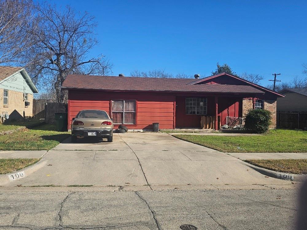 109 South Driskell Crowley, TX 76036 - Photo 1 of 7 a front view of a house with a yard and garage